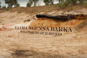 The words 'Welcome to Our River' float above a dry riverbed