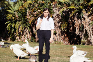 Image of women standing among geese